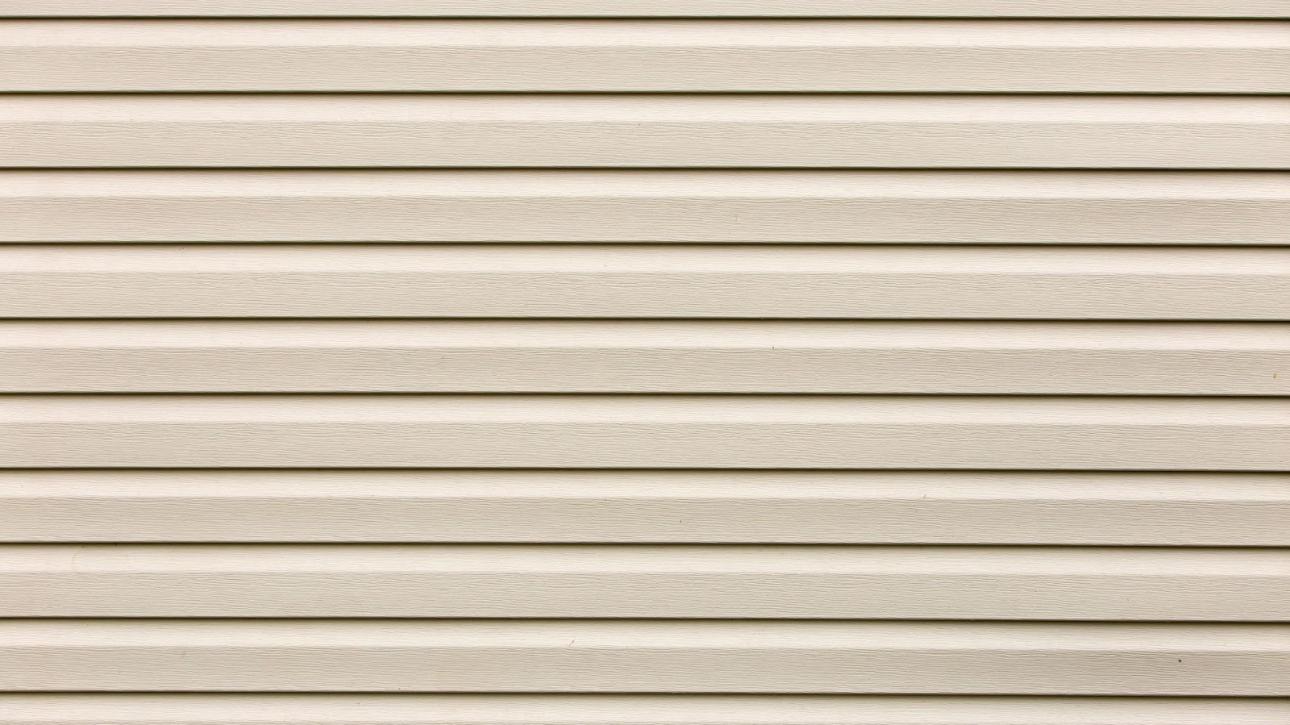 Detailed shot of vinyl plastic siding boards showing grain and alignment