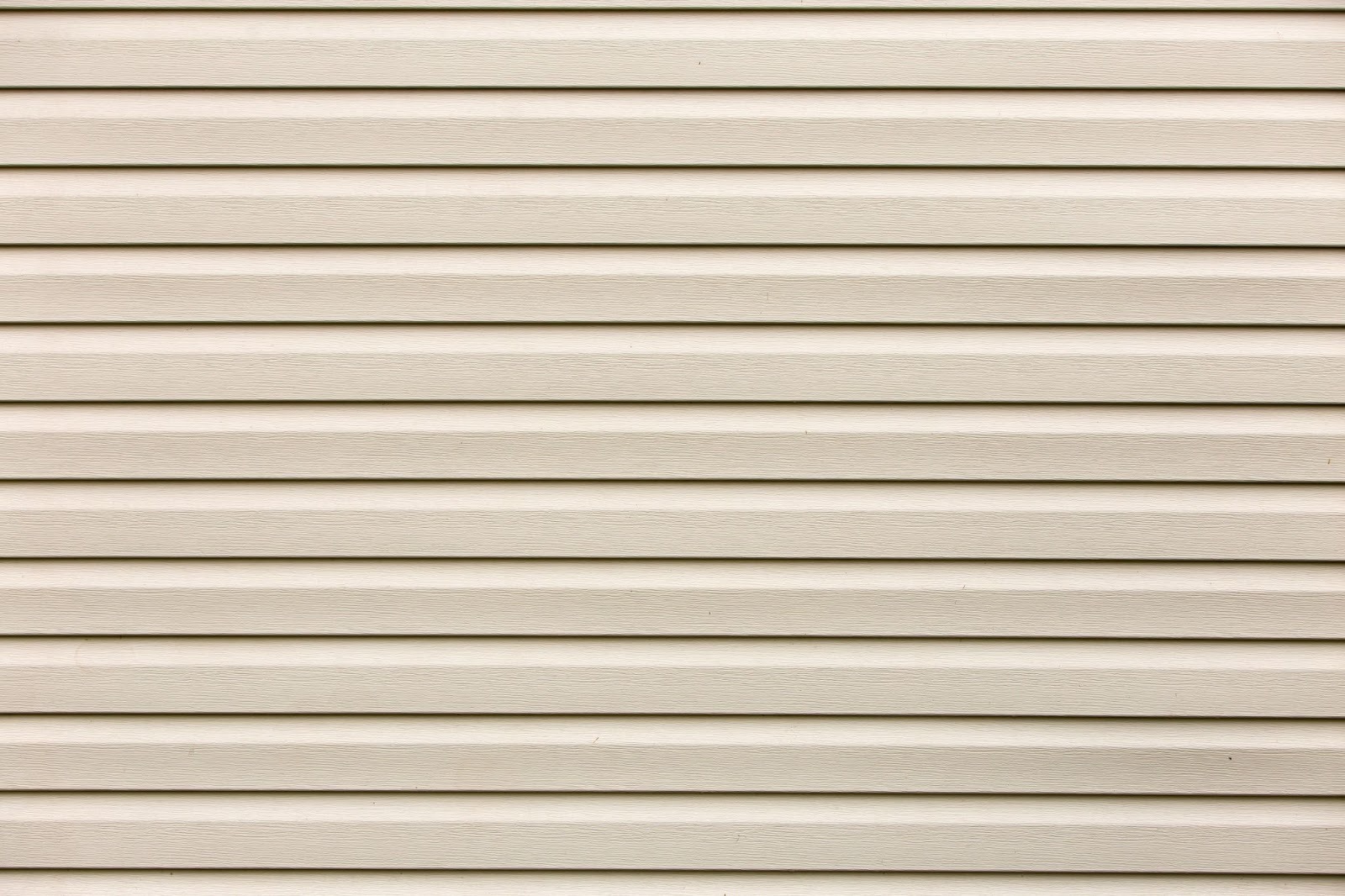 Detailed shot of vinyl plastic siding boards showing grain and alignment