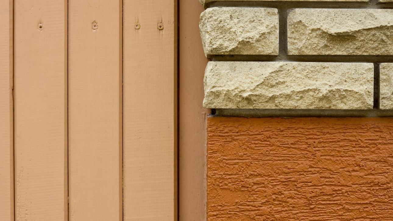 Siding material swatches in a close-up layout featuring brick, stucco texture, and wood plank surfaces