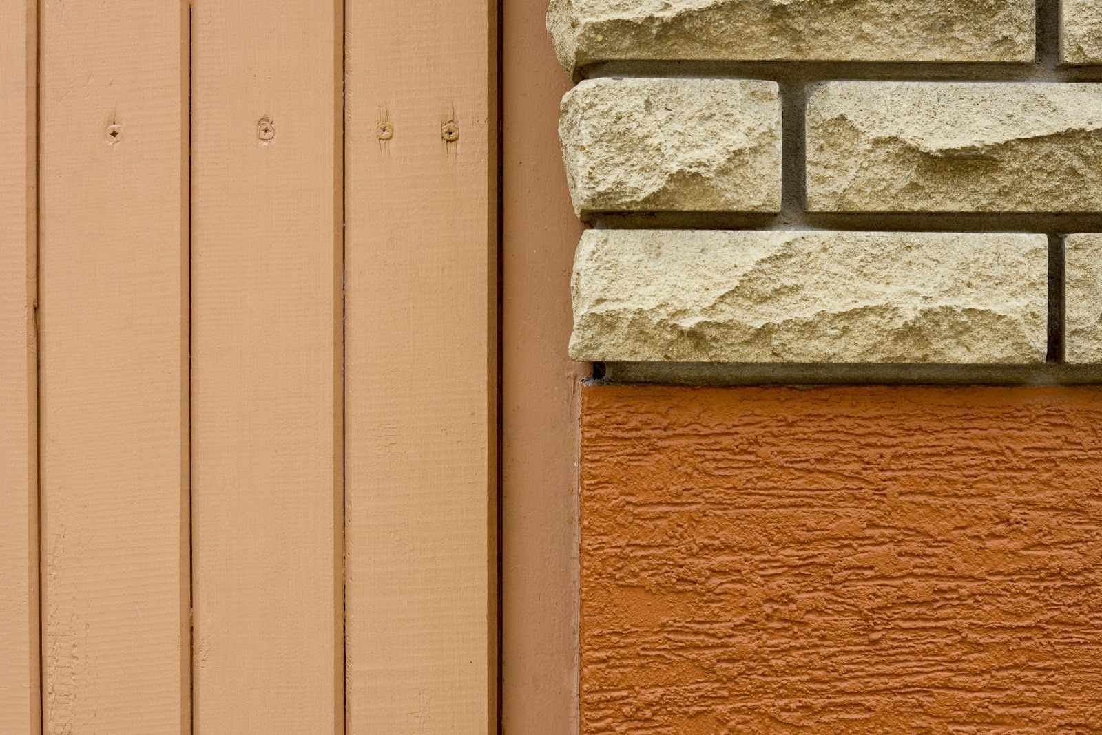 Siding material swatches in a close-up layout featuring brick, stucco texture, and wood plank surfaces